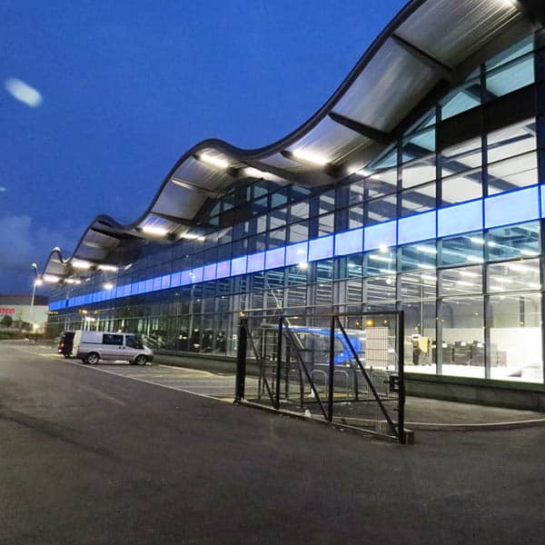 Nisbets Warehouse, a glass wavy roof building.