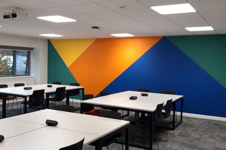 One of Yeovil College's classrooms with a abstract colourful wall